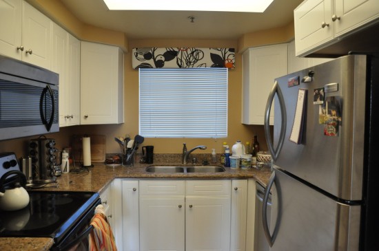 wide shot of kitchen including window above the sink