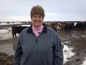 Sharon close up with cattle in background