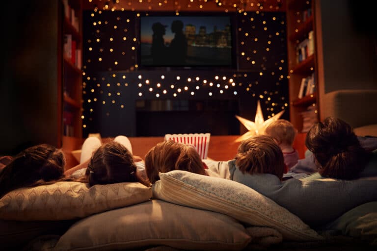 Family watching movie at night