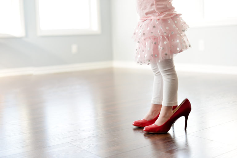 Mama's girl in red heels, color photo