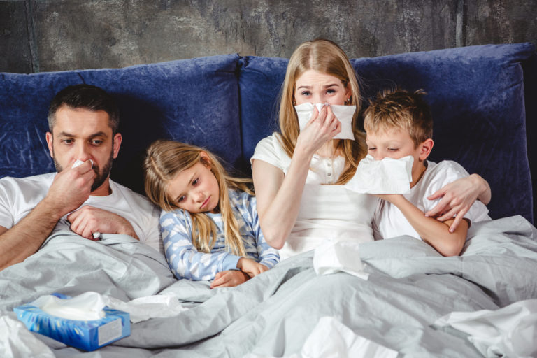sick family in bed www.herviewfromhome.com