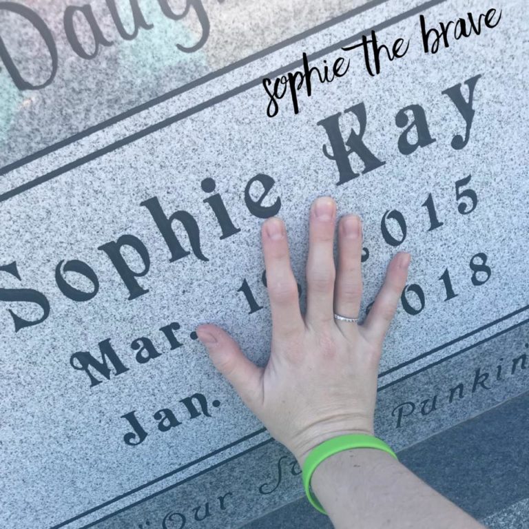 Mother's hand on Sophie Kay gravestone