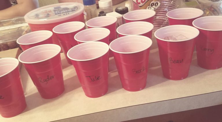 group of red Solo cups with names written on them