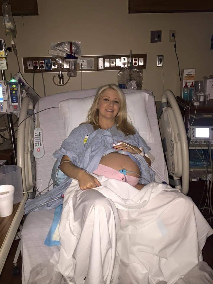 Pregnant woman in hospital bed about to give birth