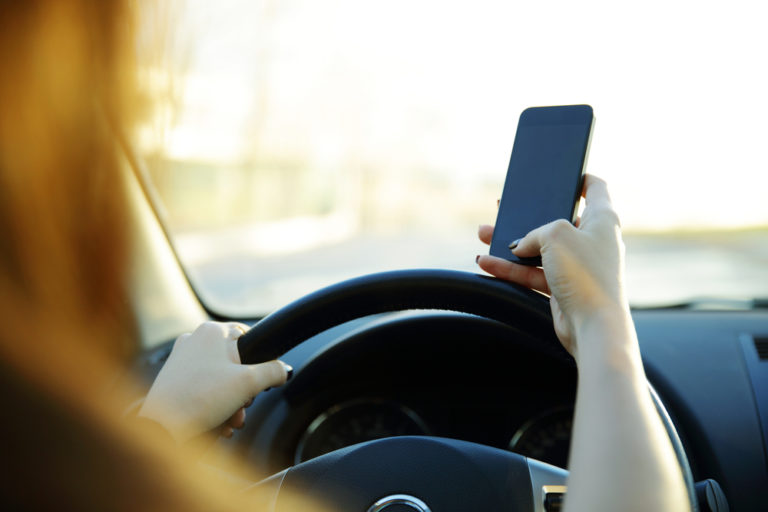 Distracted driver with cell phone and steering wheel