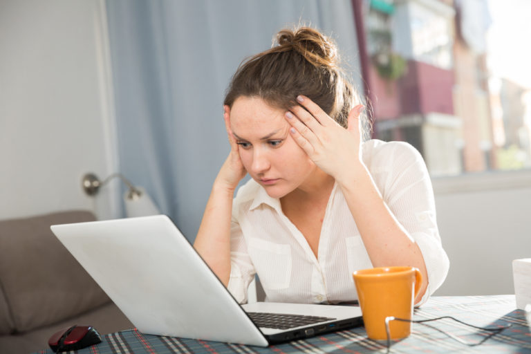 Stressed woman working at computer