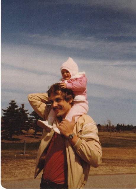 Old photo of father and toddler girl