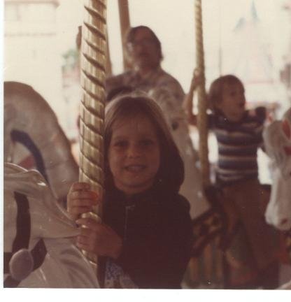 Little girl on carousel