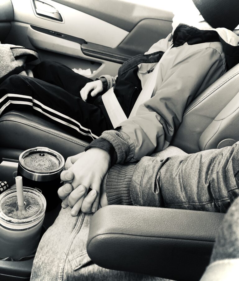 Holding hands in car