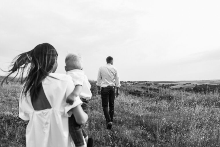 Family walking in field