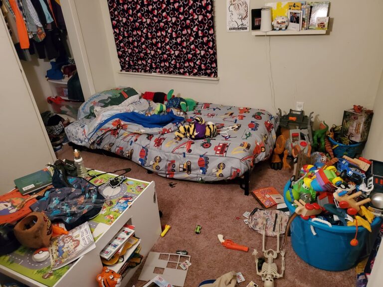 Photo of child's bedroom with toys on the floor