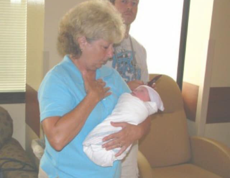 Grandma holding new baby