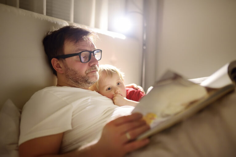 Dad reading book to toddler