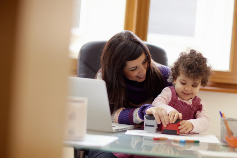 Working mom at desk with child
