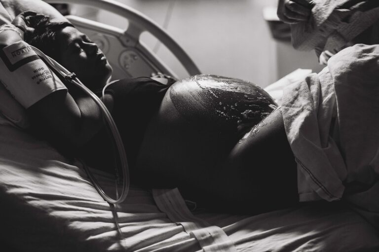 Woman in hospital bed prepped for C-section