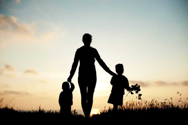 Mother and two children silhouette