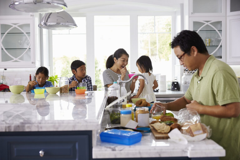 Busy family in the kitchen at home