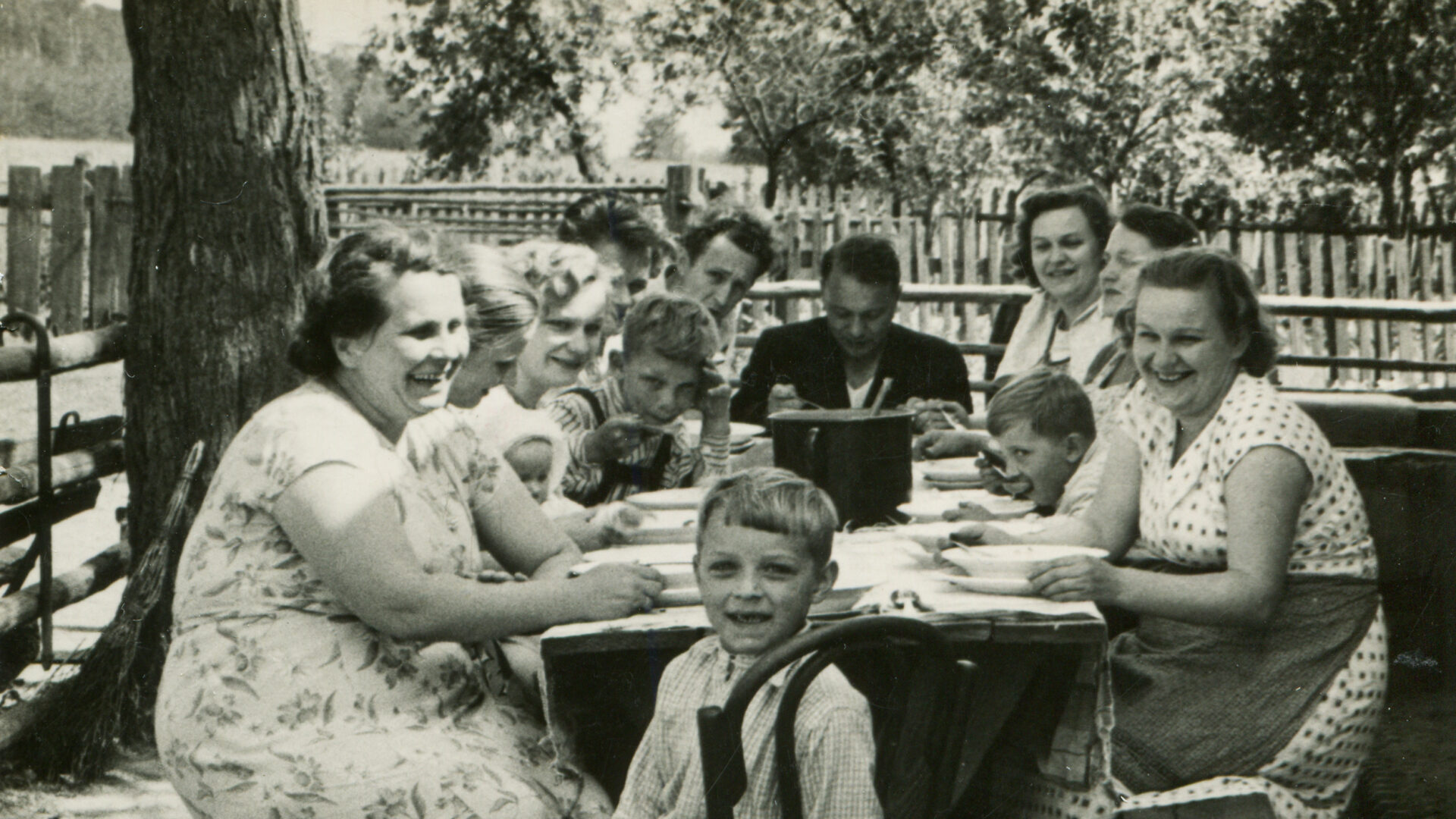 Old family photo, family sitting at table