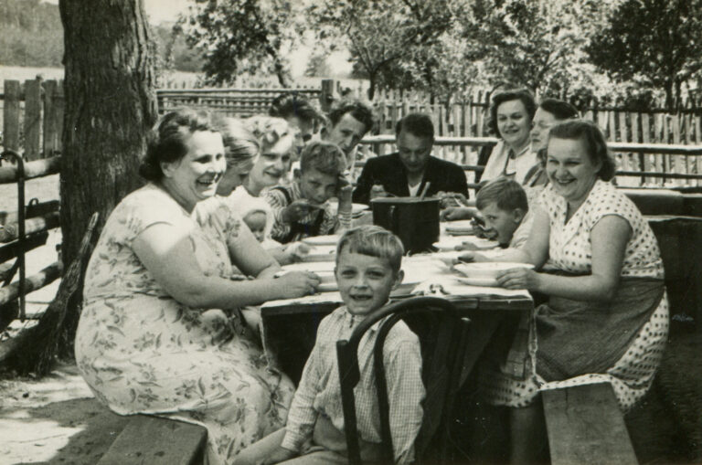 Old family photo, family sitting at table