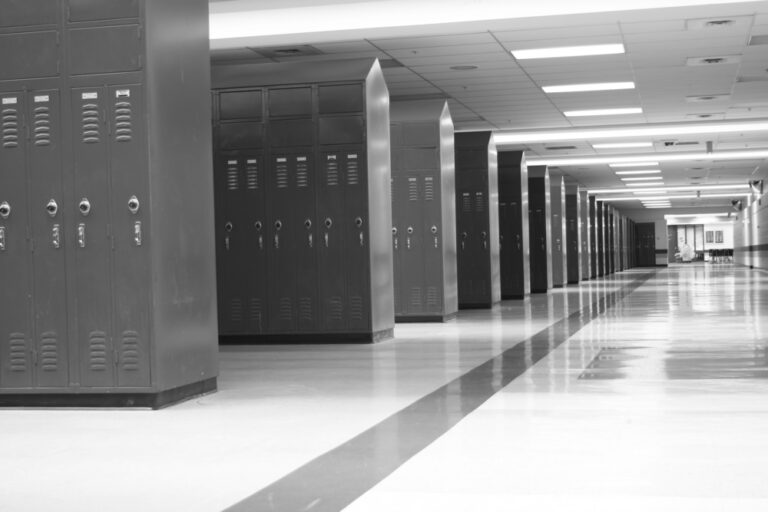 Black and white photo empty high school lockers