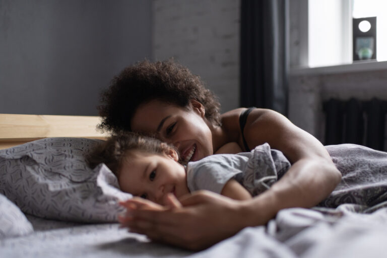 Mother with child in bed