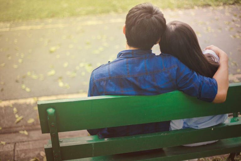 Man and woman on park bench