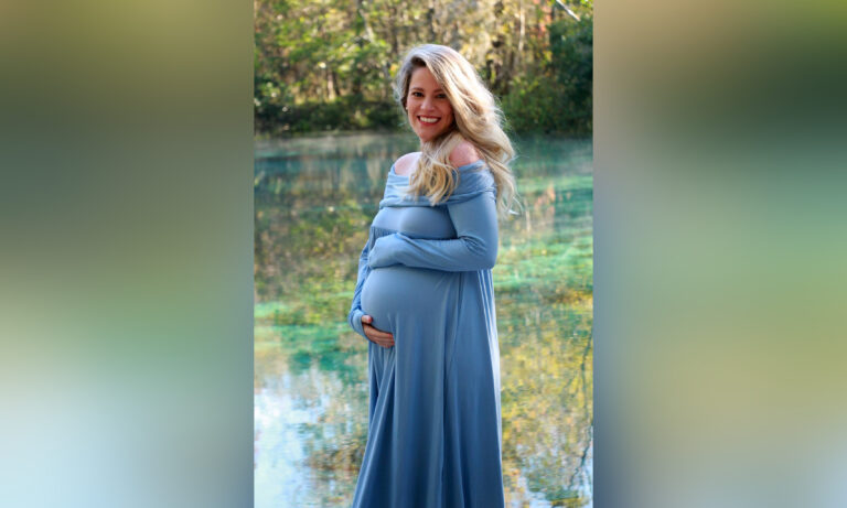 Woman holding pregnant belly