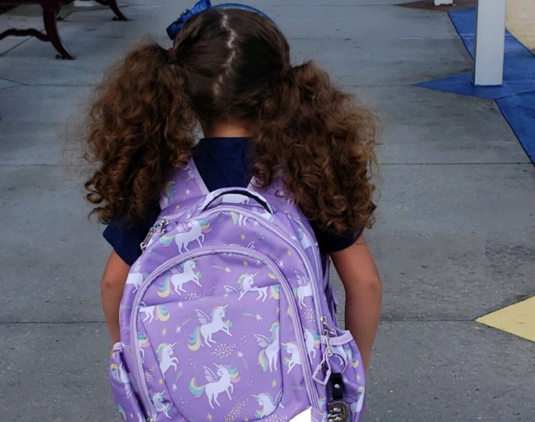Little girl with backpack