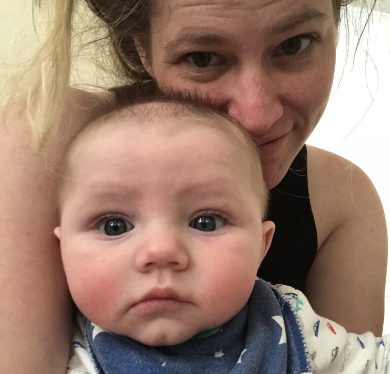 Mother holding baby, selfie, color photo
