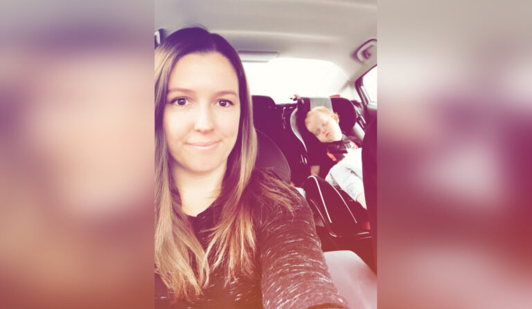 Mother with child in car selfie