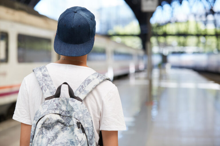 Teen walking with backpack