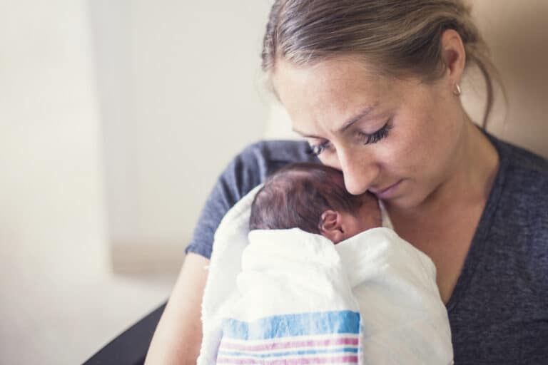 woman holding new baby