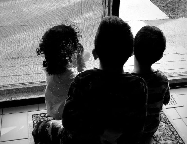 Kids looking out window