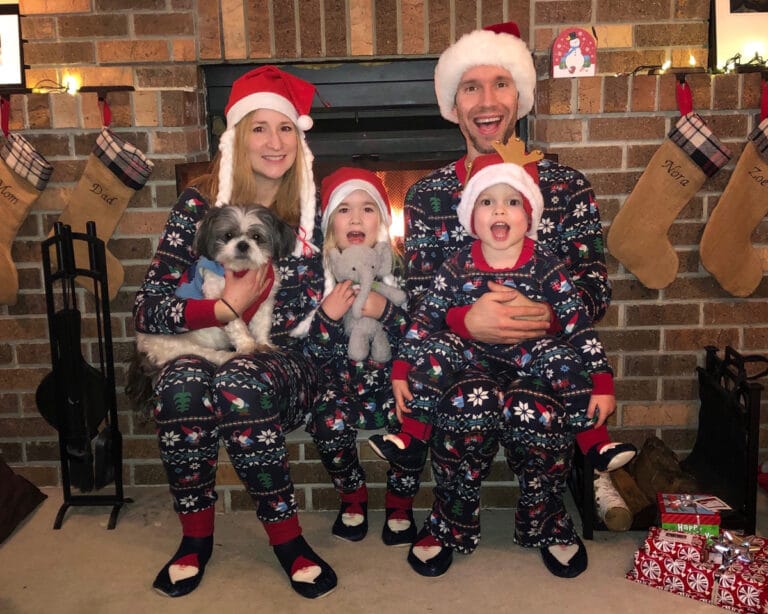 Family in matching Christmas pajamas
