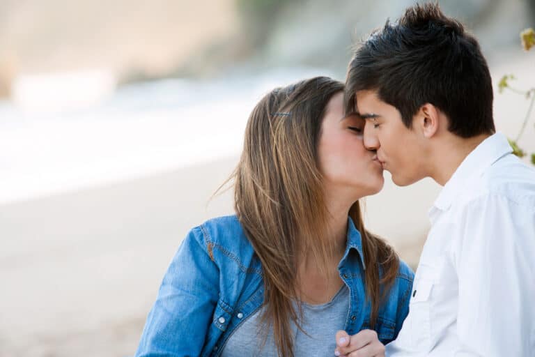 Teen couple kissing