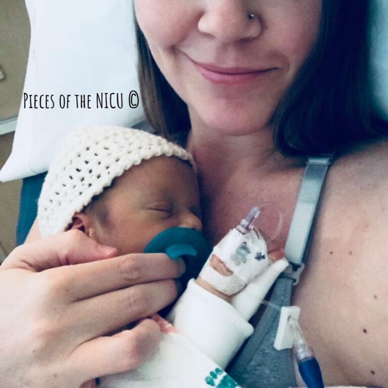 Mom holding baby in NICU, color photo
