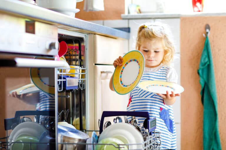 Toddler doing dishes