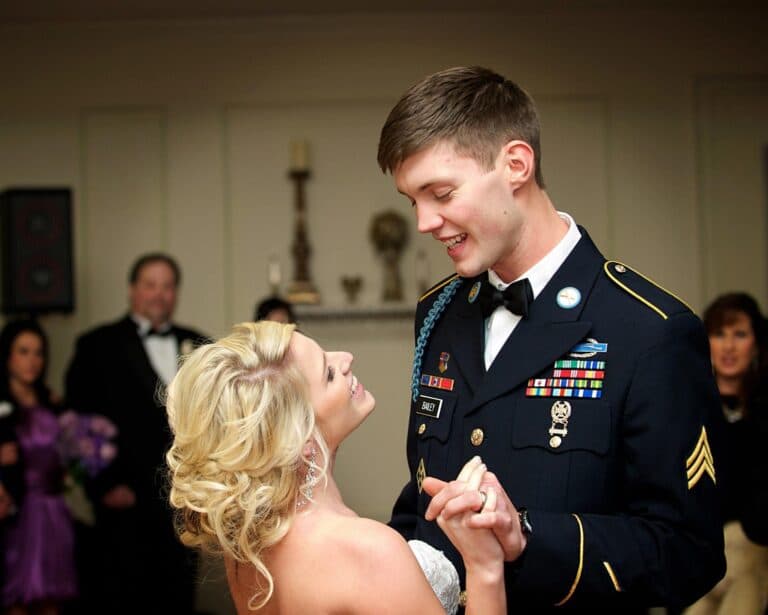 Bride and groom in military uniform, color photo