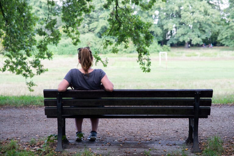 Lonely woman on bench