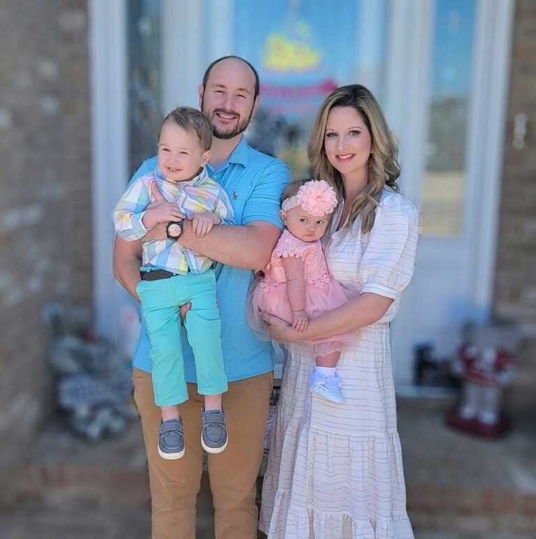 Husband and wife with two children, color photo