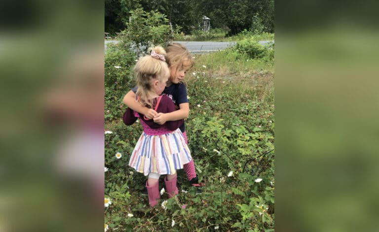 Two little girls hugging