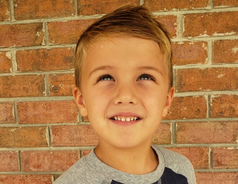 Little boy smiling, color photo
