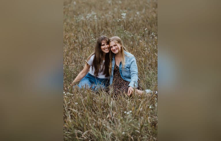 Mother and teen daughter, color photo
