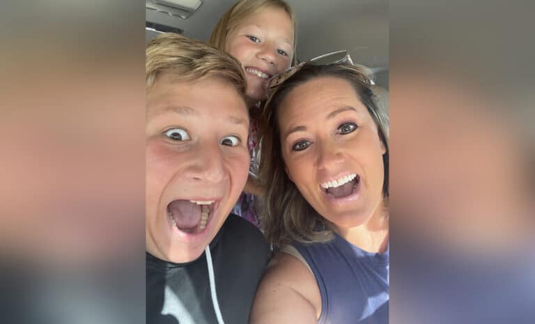Mother, teen son, and young daughter selfie, color photo