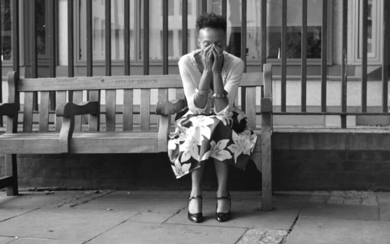 Sad woman crying on bench