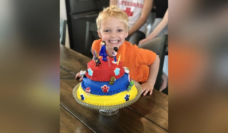 Little boy with birthday cake, color photo