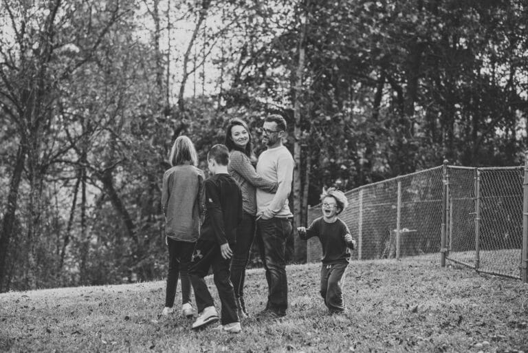 Husband, wife, and three kids, black-and-white photo