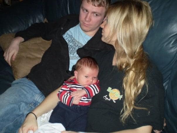 Older photo of young couple and baby, color photo