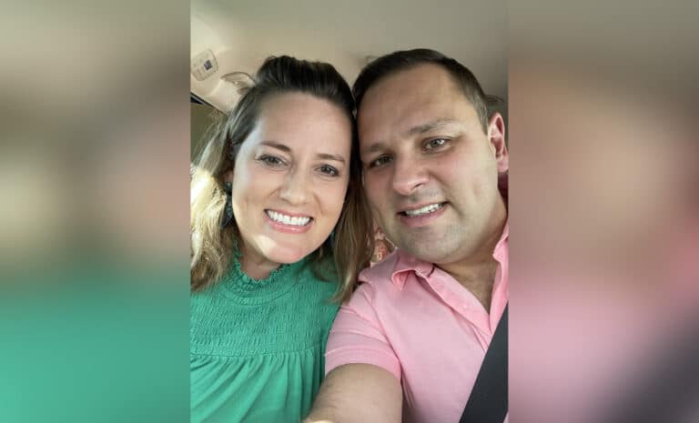 Husband and wife selfie in car, color photo