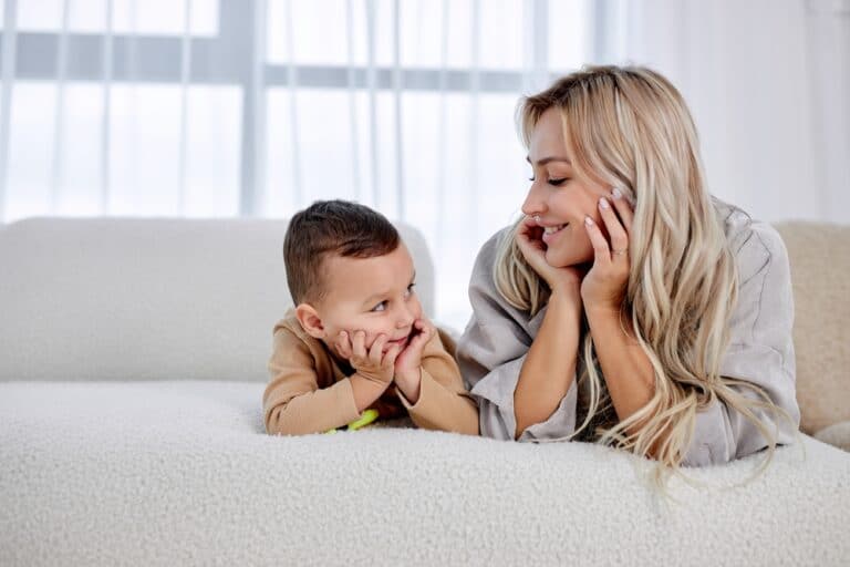 Woman with young son smiling